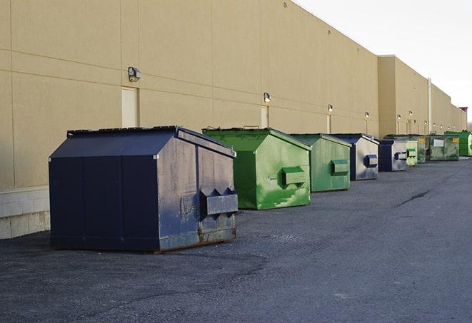 a fleet of red and blue construction dumpsters available for use in Alviso